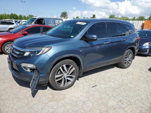HONDA PILOT TOUR 2017 with VIN 5FNYF6H92HB039452 - Photo from auction
