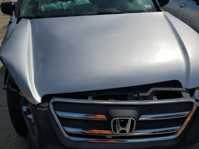 Photo 12 from auction – 2005 HONDA CR-V LX with VIN JHLRD68525C016109