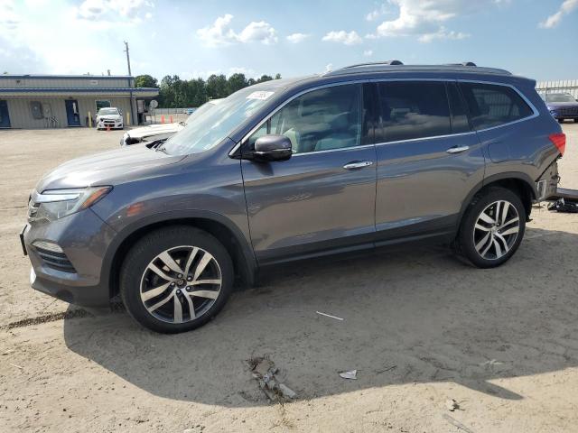 HONDA PILOT TOUR 2016 with VIN 5FNYF6H94GB022862 - Photo from auction