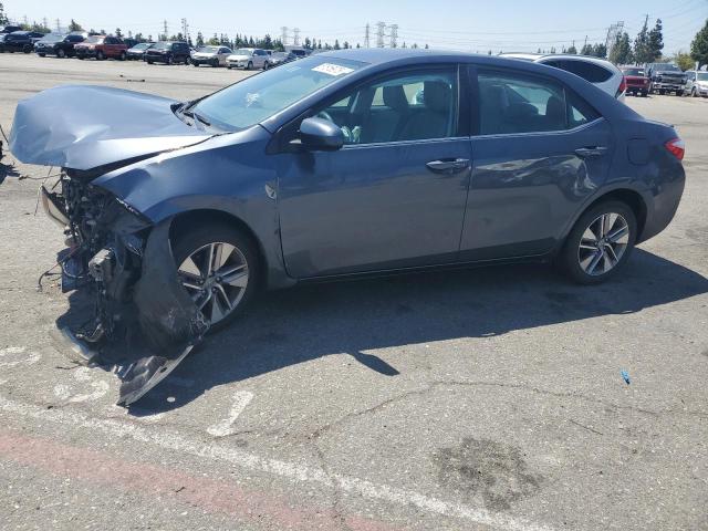 TOYOTA COROLLA EC 2015 with VIN 5YFBPRHEXFP191045 - Photo from auction