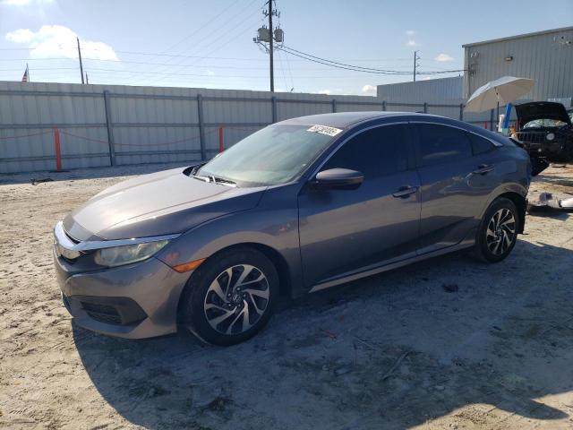 HONDA CIVIC EX 2018 with VIN 19XFC2F75JE036499 - Photo from auction