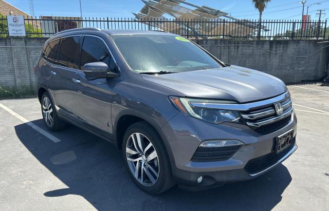 HONDA PILOT TOUR 2016 with VIN 5FNYF5H94GB048761 - Photo from auction