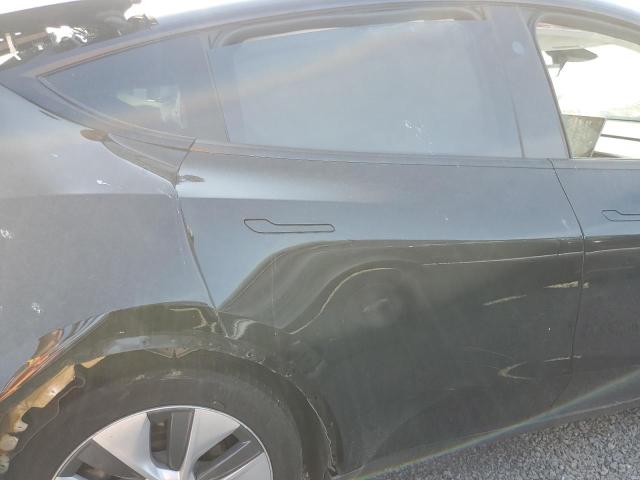 Photo 11 from auction – 2024 TESLA MODEL Y with VIN 7SAYGAEEXRF994330