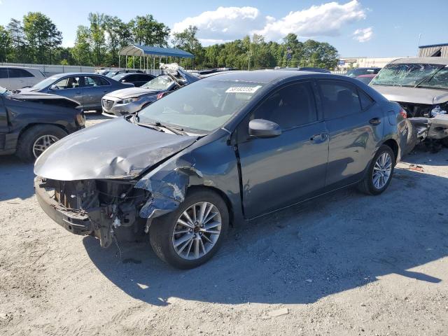 TOYOTA COROLLA L 2014 with VIN 5YFBURHE0EP011305 - Photo from auction