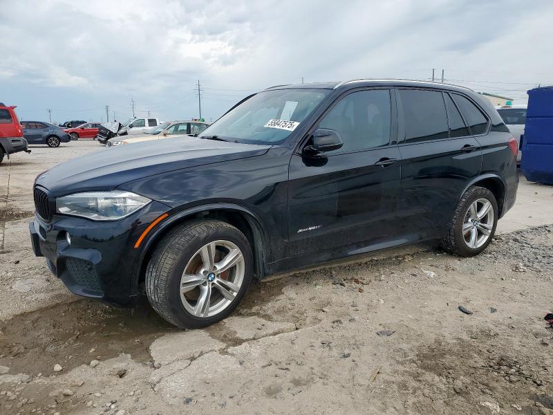 BMW X5 M 2015 with VIN 5UXKR6C55F0J74811 - Photo from auction
