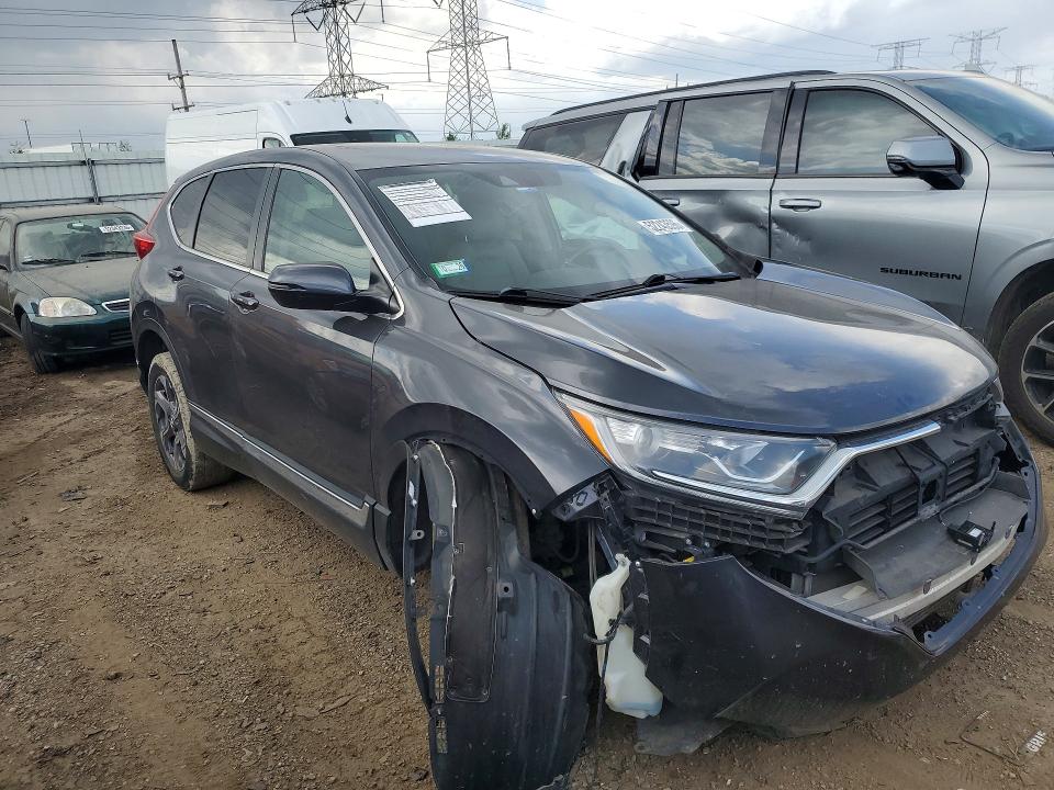 Photo 4 from auction – 2018 HONDA CR-V with VIN 7FARW2H85JE070371