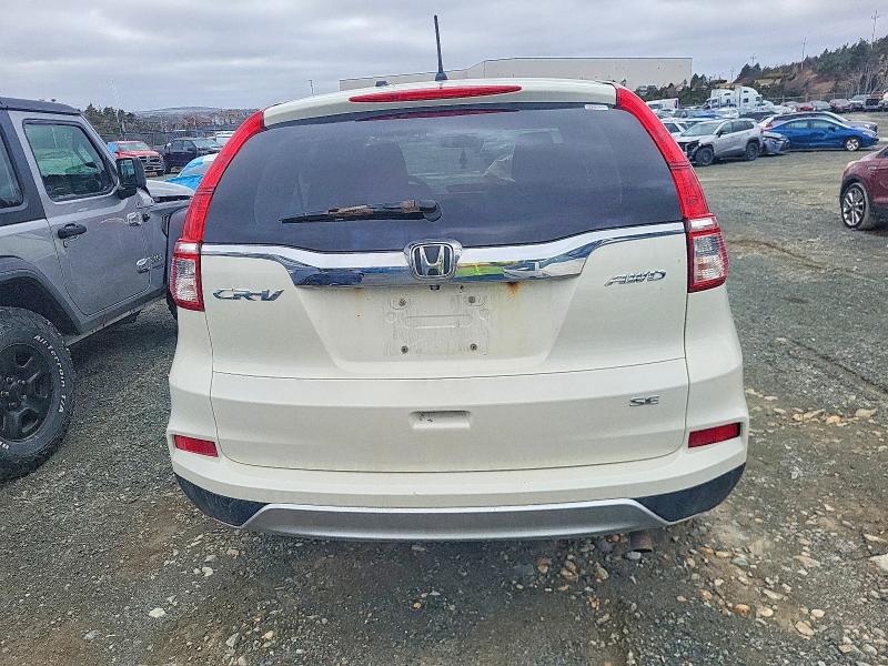 Photo 6 from auction – 2015 HONDA CR-V with VIN 2HKRM4H42FH123420