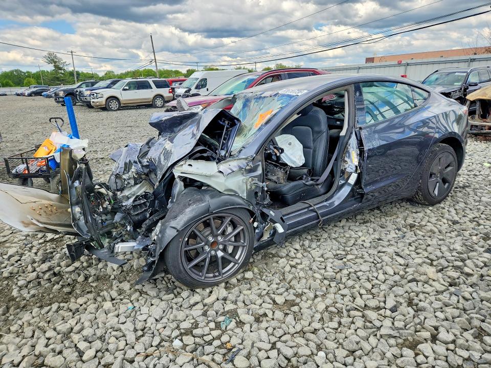 TESLA MODEL 3 2023 с VIN 5YJ3E1EA0PF657818 - Снимка от търг