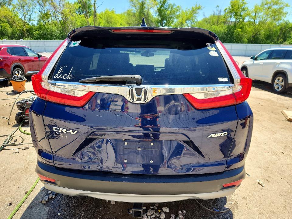 Photo 6 from auction – 2018 HONDA CR-V with VIN 7FARW2H83JE053004