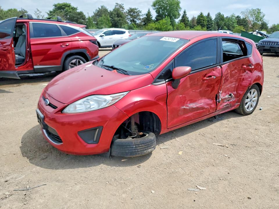 FORD FIESTA 2011 with VIN 3FADP4EJ0BM144658 - Photo from auction