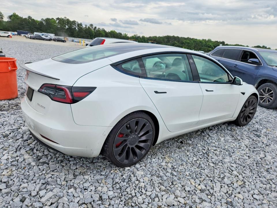 Photo 3 from auction – 2021 TESLA MODEL 3 with VIN 5YJ3E1EC2MF020233