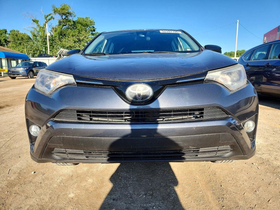 Photo 5 from auction – 2018 TOYOTA RAV4 with VIN JTMZFREV5JD109675