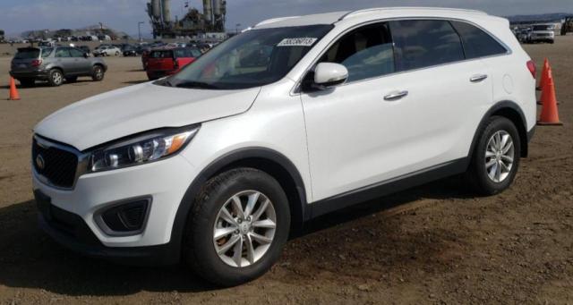 KIA SORENTO LX 2016 with VIN 5XYPG4A32GG051935 - Photo from auction