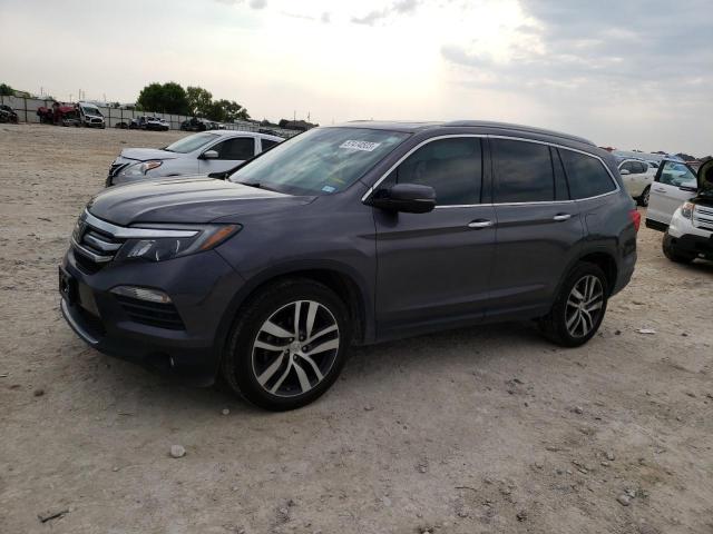 HONDA PILOT TOUR 2018 with VIN 5FNYF6H97JB034804 - Photo from auction