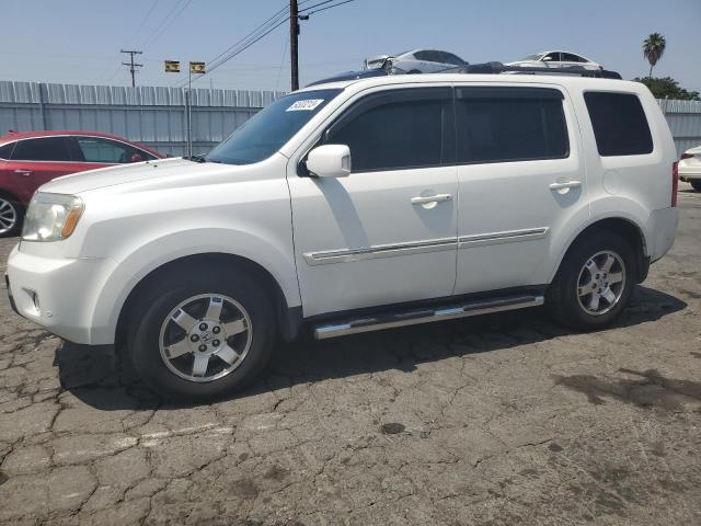 HONDA PILOT TOUR 2011 with VIN 5FNYF4H95BB040767 - Photo from auction
