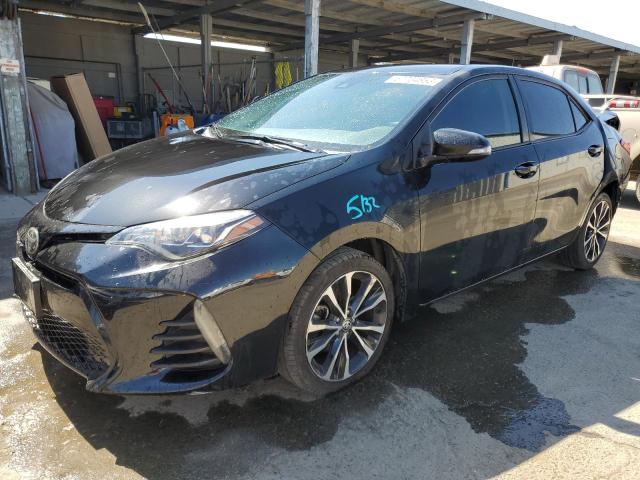 TOYOTA COROLLA L 2017 with VIN 5YFBURHE5HP696065 - Photo from auction