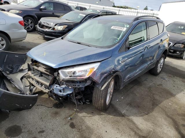 FORD ESCAPE SE 2018 with VIN 1FMCU9GD9JUC10696 - Photo from auction