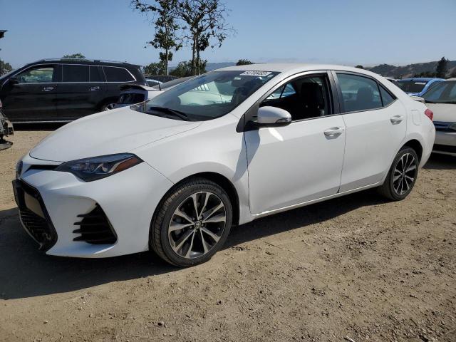 TOYOTA COROLLA L 2019 with VIN 5YFBURHE8KP858181 - Photo from auction