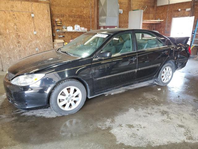 TOYOTA CAMRY LE 2002 with VIN 4T1BE30K92U097381 - Photo from auction
