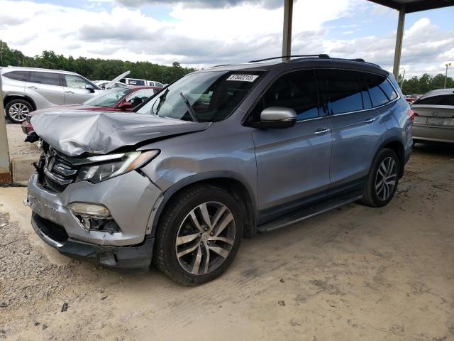 HONDA PILOT TOUR 2016 with VIN 5FNYF5H94GB033659 - Photo from auction