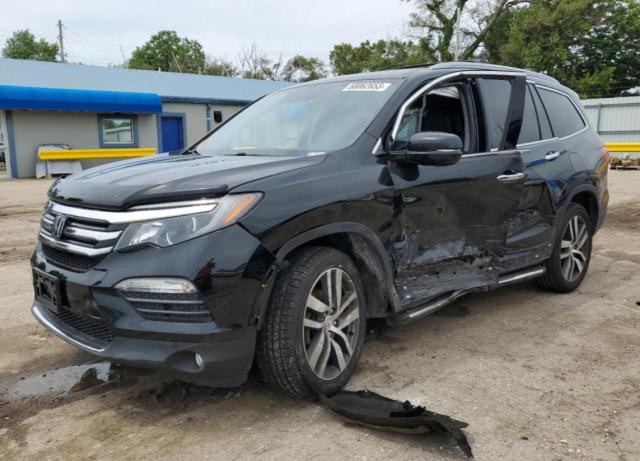 HONDA PILOT TOUR 2017 with VIN 5FNYF6H92HB097559 - Photo from auction