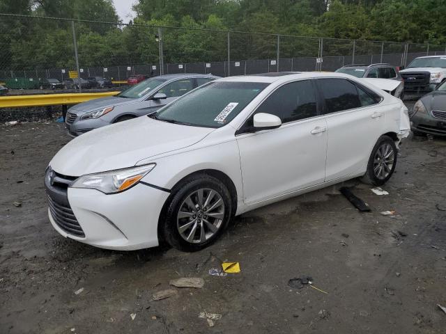 TOYOTA CAMRY LE 2017 with VIN 4T1BF1FK0HU764825 - Photo from auction