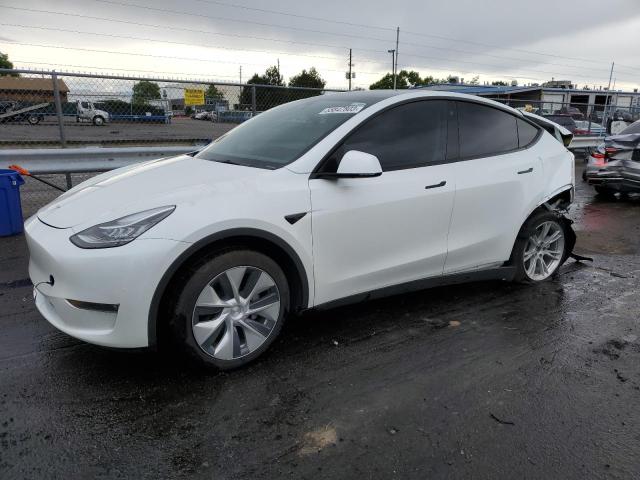TESLA MODEL Y 2022 with VIN 7SAYGAEE0NF313473 - Photo from auction