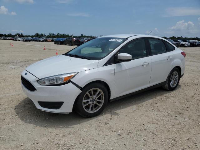 FORD FOCUS SE 2018 with VIN 1FADP3F20JL242140 - Photo from auction