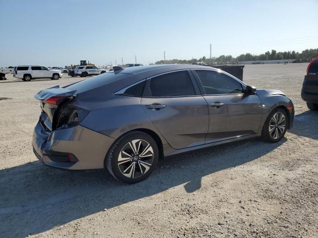 Photo 3 from auction – 2018 HONDA CIVIC EX with VIN JHMFC1F32JX042802