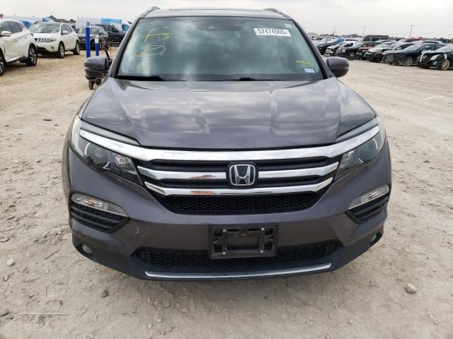 Photo 5 from auction – 2018 HONDA PILOT TOUR with VIN 5FNYF6H97JB034804