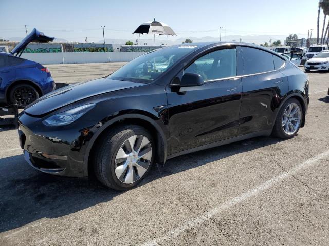 TESLA MODEL Y 2022 with VIN 7SAYGAEE4NF402124 - Photo from auction