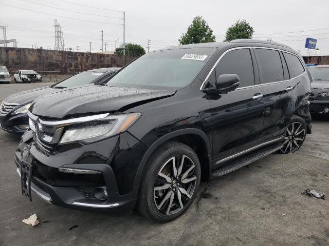 HONDA PILOT TOUR 2019 with VIN 5FNYF5H95KB033260 - Photo from auction