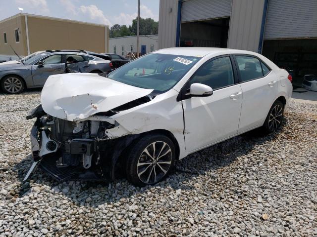 TOYOTA COROLLA L 2019 with VIN 5YFBURHE7KP860973 - Photo from auction