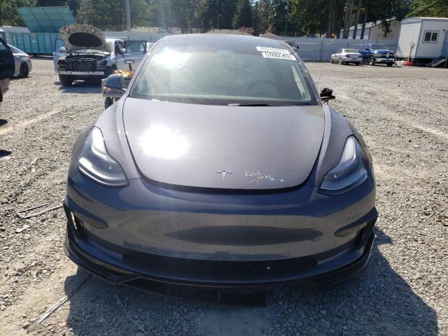 Photo 5 from auction – 2022 TESLA MODEL 3 with VIN 5YJ3E1ECXNF163321