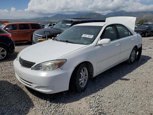 TOYOTA CAMRY LE 2004 with VIN 4T1BF32KX4U081798 - Photo from auction