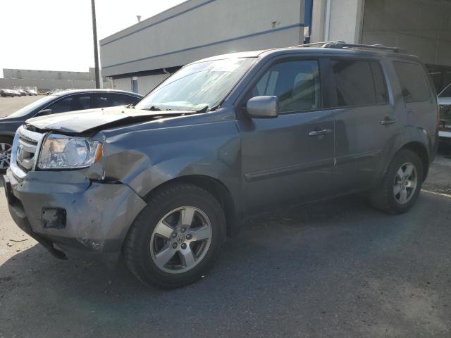 HONDA PILOT EXL 2011 with VIN 5FNYF4H54BB044032 - Photo from auction