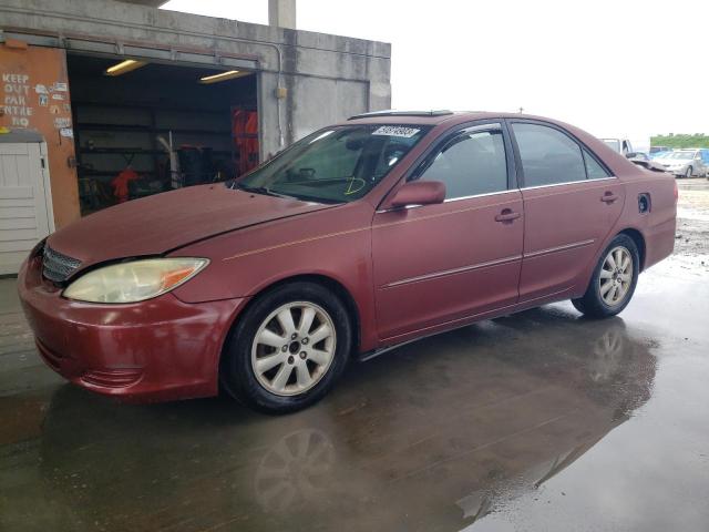 TOYOTA CAMRY LE 2002 with VIN 4T1BF30K22U027296 - Photo from auction
