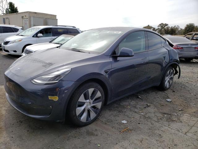 TESLA MODEL Y 2022 with VIN 7SAYGDEE0NF402283 - Photo from auction