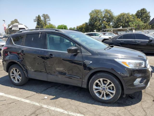 Photo 4 from auction – 2018 FORD ESCAPE SE with VIN 1FMCU0GD2JUC61663