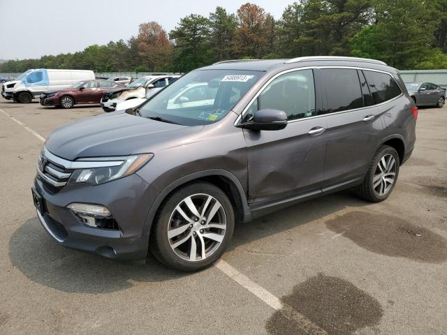 HONDA PILOT TOUR 2018 with VIN 5FNYF6H91JB066521 - Photo from auction