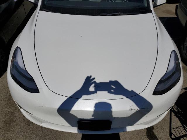 Photo 11 from auction – 2022 TESLA MODEL Y with VIN 7SAYGDEE7NF403463