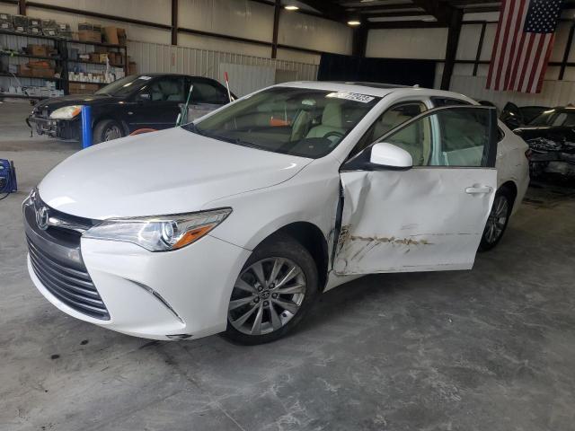 TOYOTA CAMRY LE 2015 with VIN 4T1BF1FKXFU975883 - Photo from auction