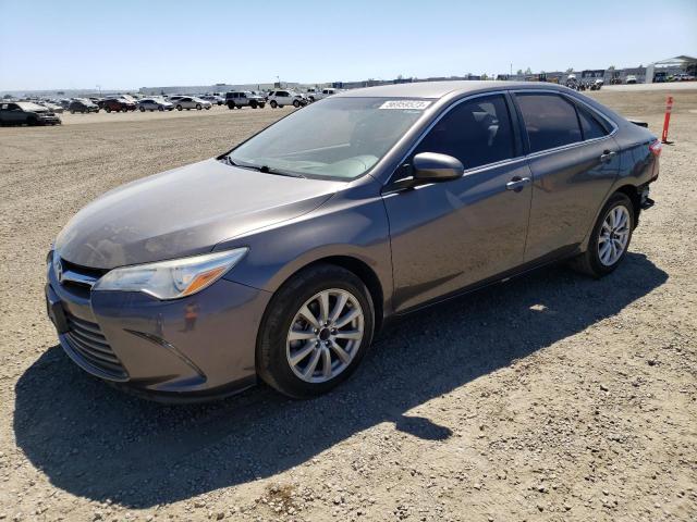 TOYOTA CAMRY LE 2017 with VIN 4T1BF1FKXHU446128 - Photo from auction