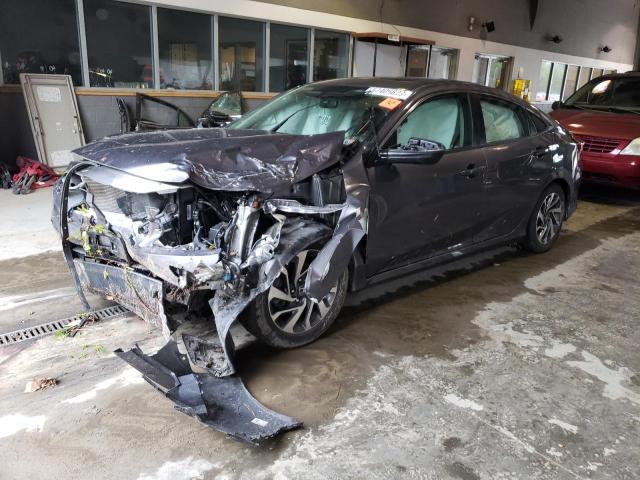 HONDA CIVIC EX 2018 with VIN 19XFC2F7XJE203584 - Photo from auction
