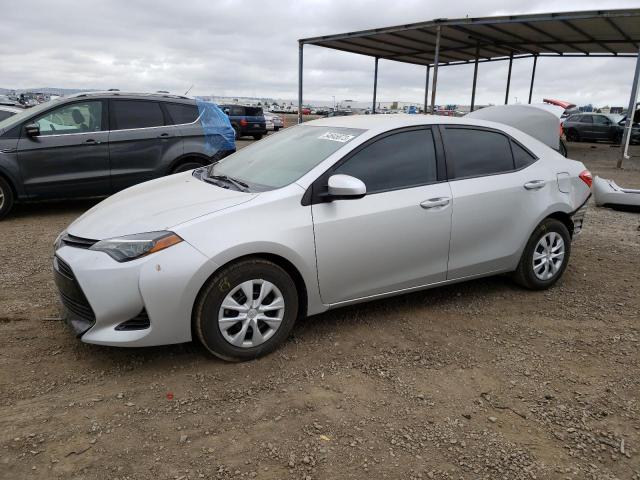 TOYOTA COROLLA L 2019 with VIN 5YFBURHE9KP864099 - Photo from auction