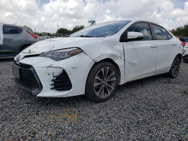 TOYOTA COROLLA L 2018 with VIN 5YFBURHE5JP785298 - Photo from auction