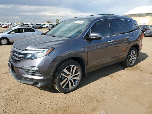 HONDA PILOT TOUR 2018 with VIN 5FNYF6H96JB069558 - Photo from auction