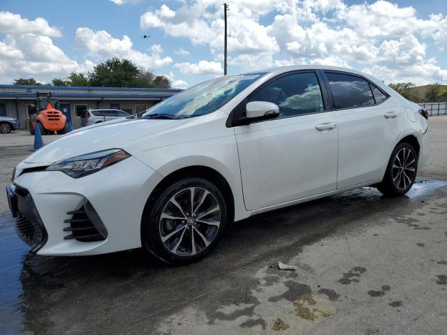 TOYOTA COROLLA L 2018 with VIN 5YFBURHE0JP824430 - Photo from auction