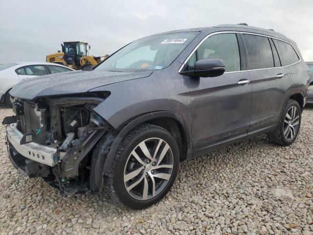 HONDA PILOT TOUR 2017 with VIN 5FNYF6H92HB007360 - Photo from auction