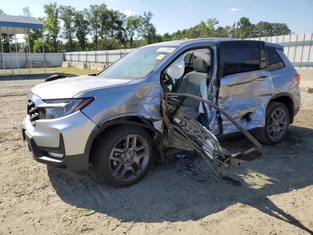 HONDA PASSPORT E 2023 with VIN 5FNYF8H52PB032850 - Photo from auction